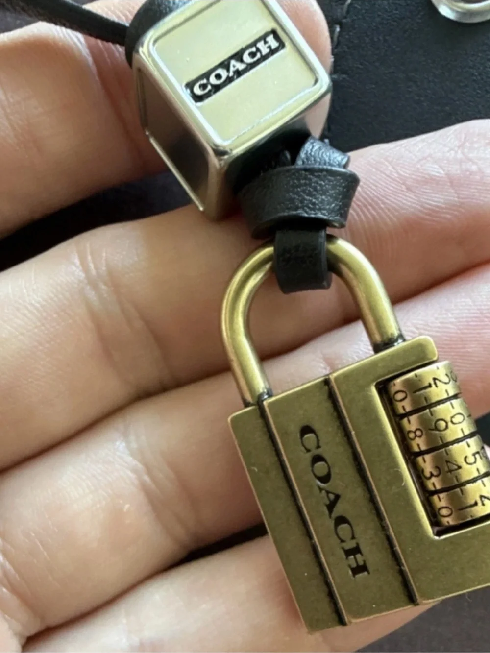 Coach Black Leather Heart Tag with Gold Lock and Silver Bow Charms